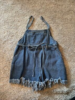 Blue denim frayed overalls